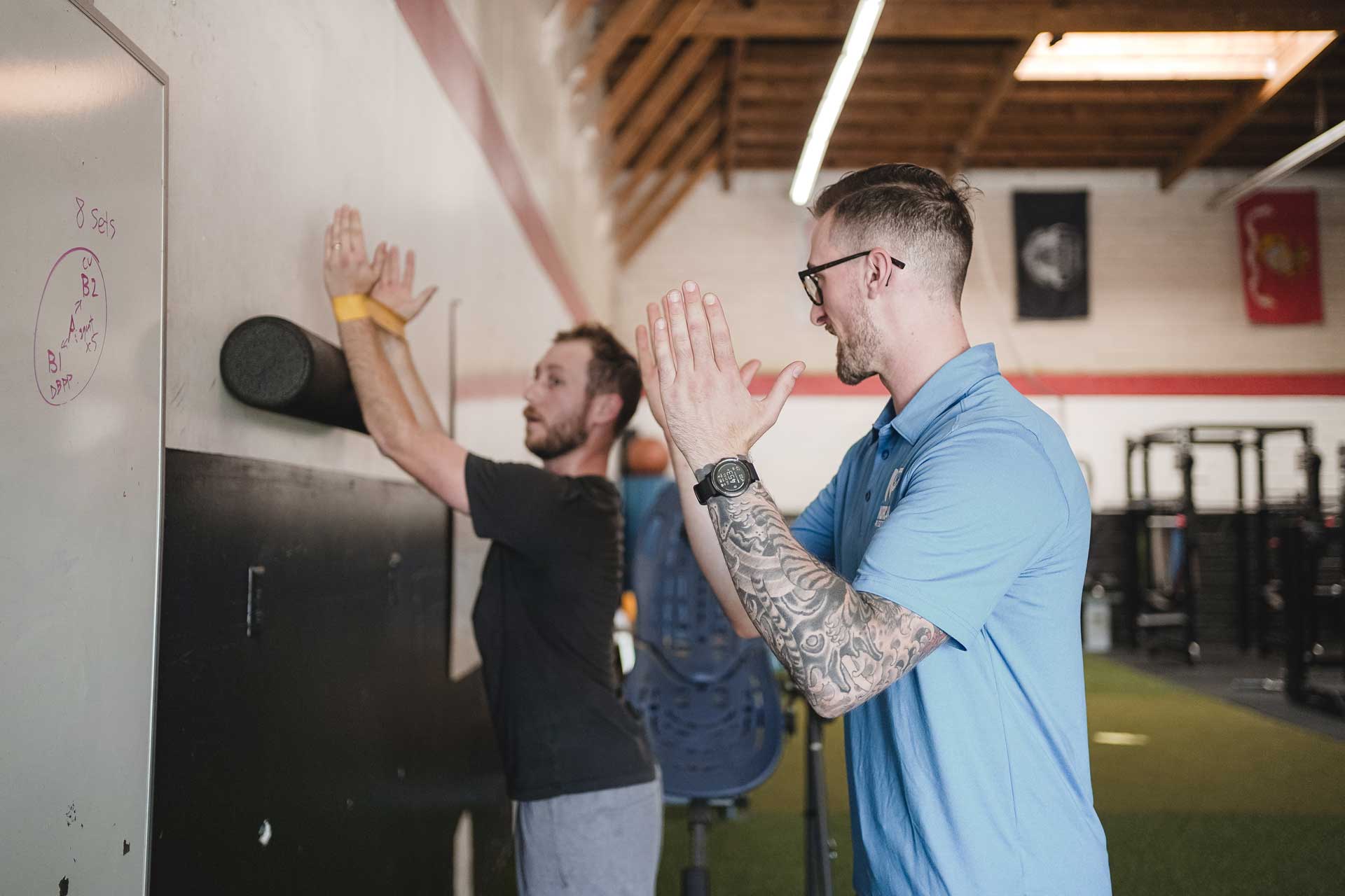 Someone with arms outstretched doing a physical training excercise 